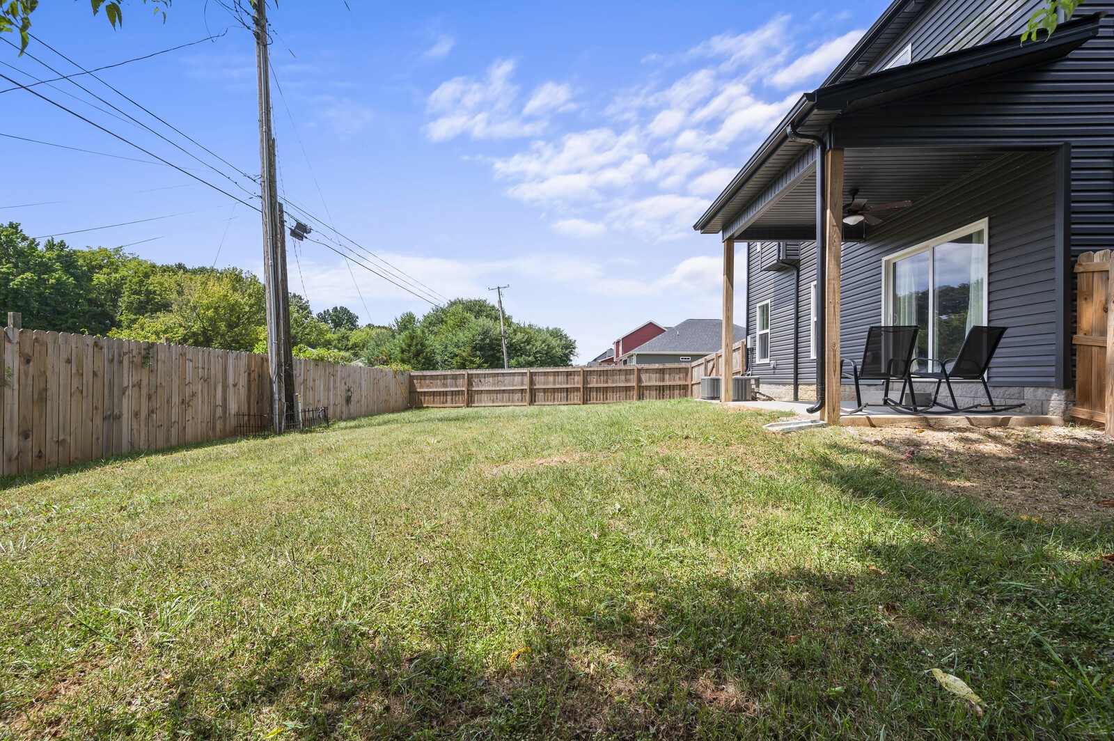 246 King Road Clarksville, TN 37042 - Photo 18 of 21 a view of a house with a backyard and a chair