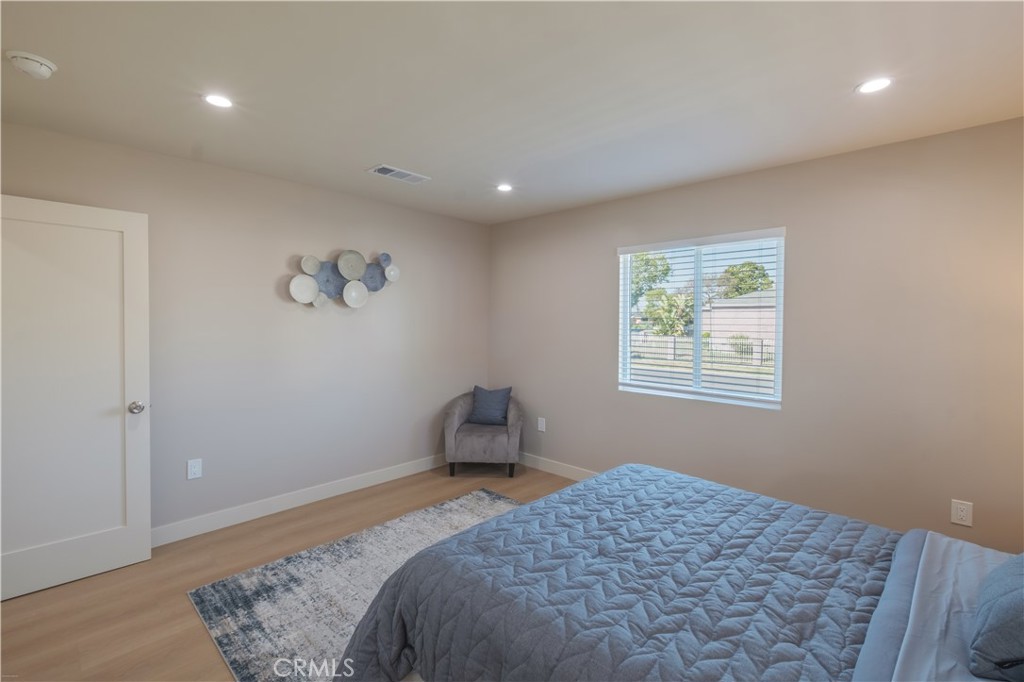 223 South Aprilia Avenue Compton, CA 90220 - Photo 13 of 46 a bedroom with a bed and a window