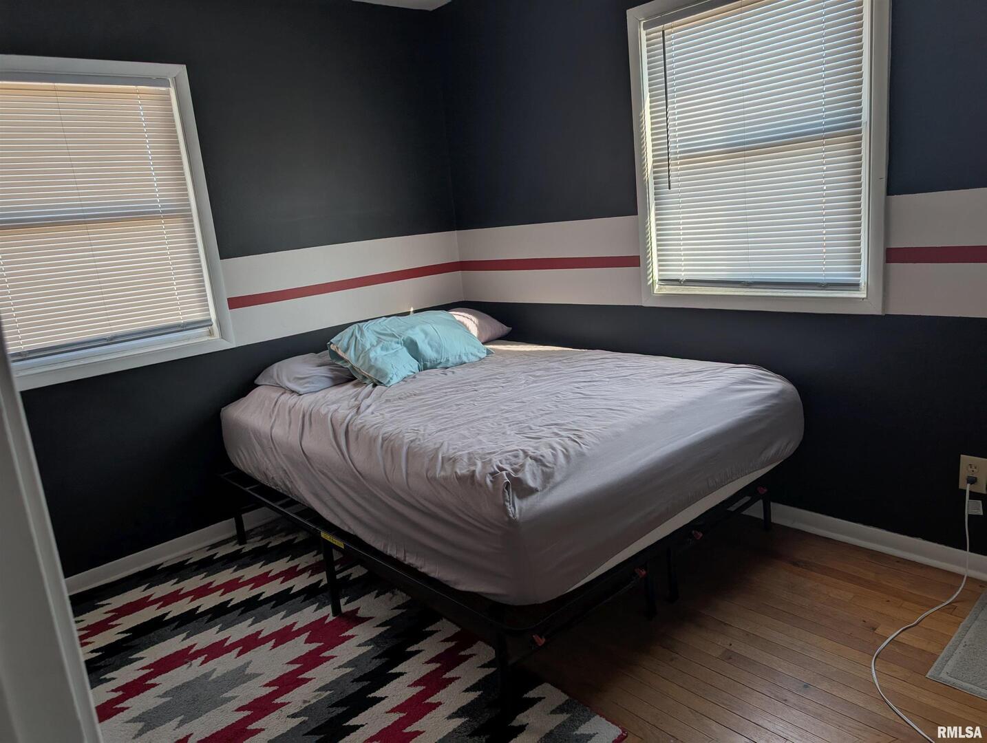 21 Manor Drive Park View, IA 52748 - Photo 4 of 9 a bedroom with a bed and window