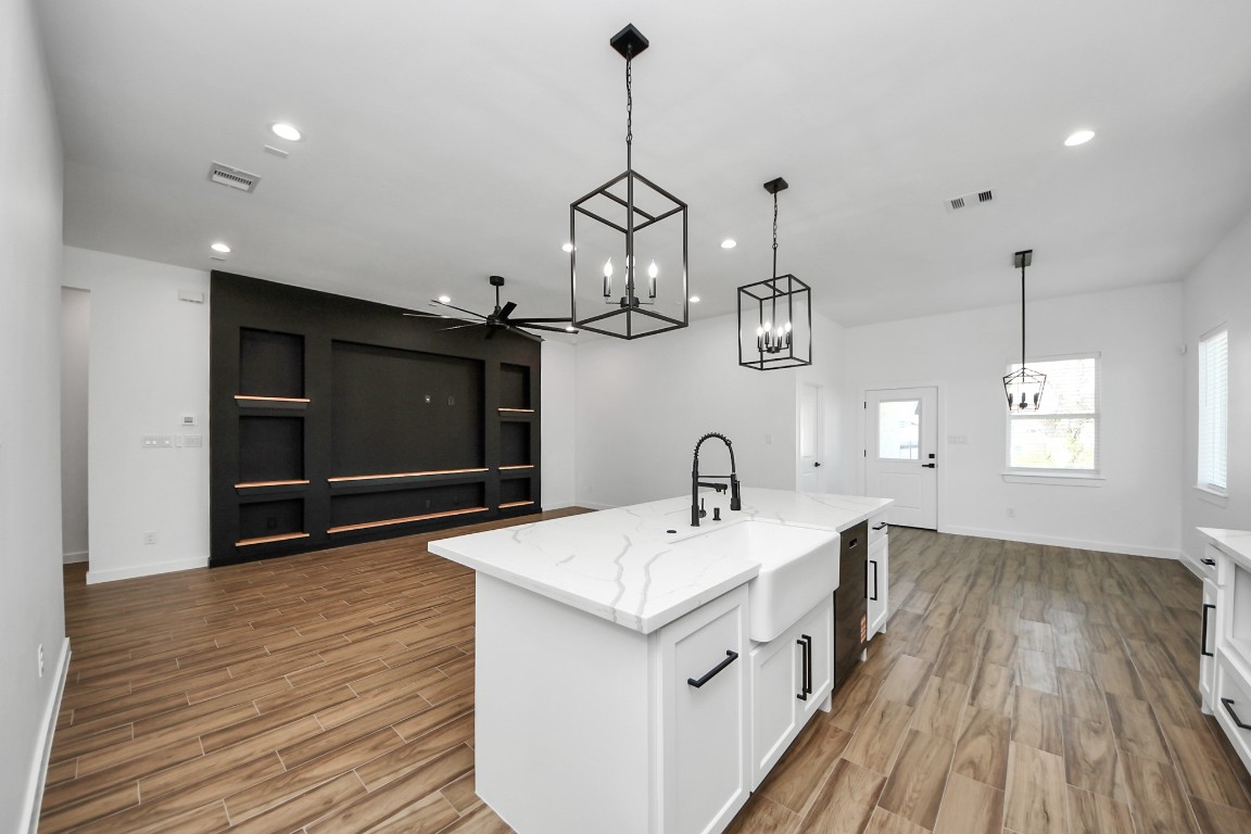 207 Manor Avenue Arcola, TX 77583 - Photo 20 of 37 a kitchen with a sink and wooden floor