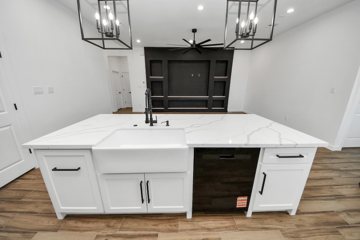 207 Manor Avenue Arcola, TX 77583 - Photo 23 of 37 a kitchen with a sink and a fireplace