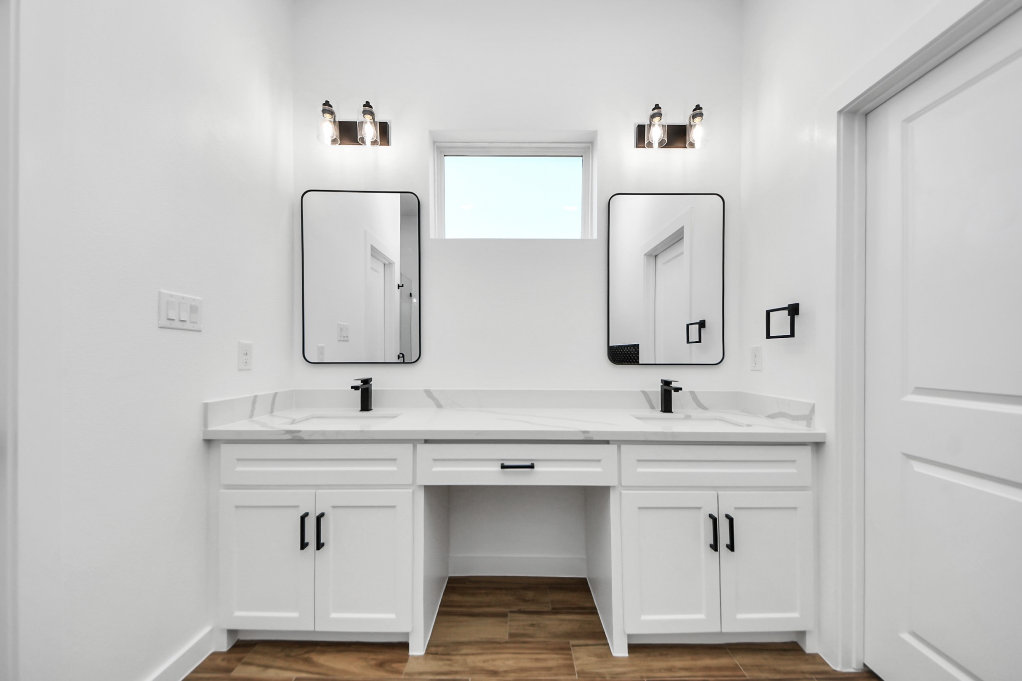 207 Manor Avenue Arcola, TX 77583 - Photo 29 of 37 a bathroom with double vanity sinks and a mirror