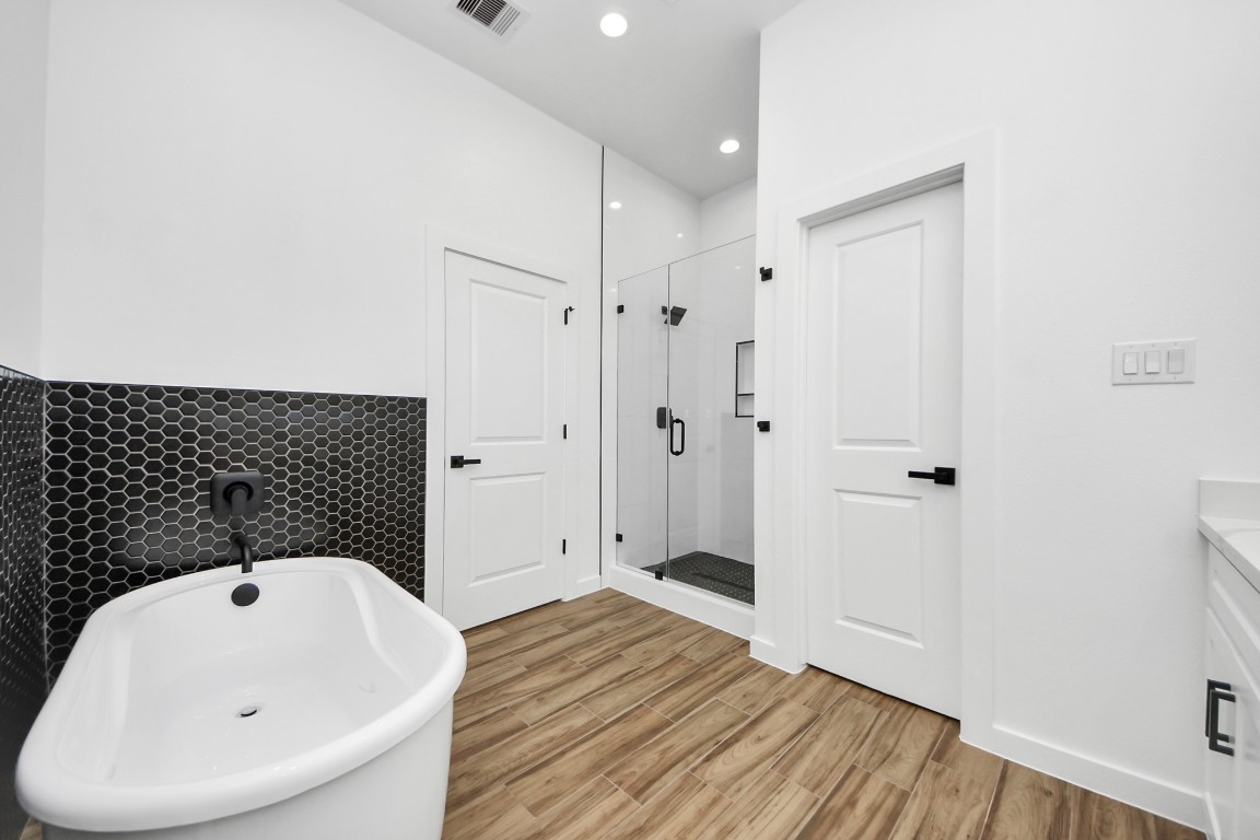 207 Manor Avenue Arcola, TX 77583 - Photo 30 of 37 a bathroom with a bathtub and shower