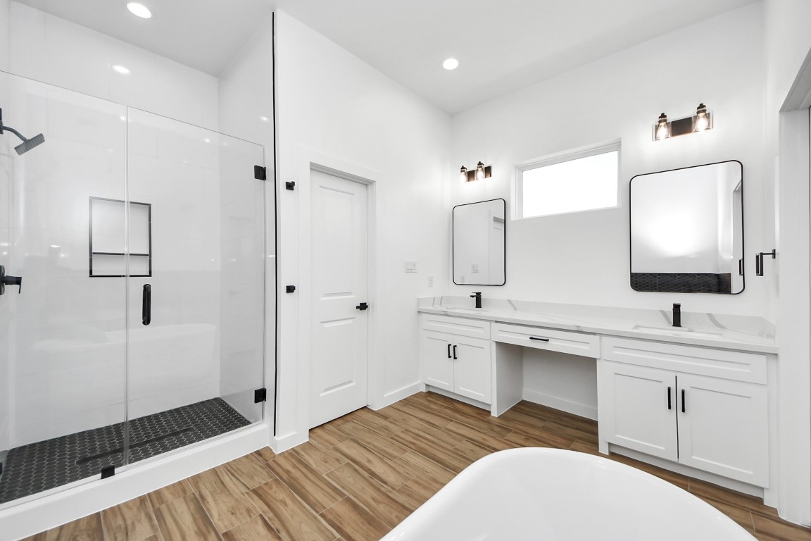 207 Manor Avenue Arcola, TX 77583 - Photo 31 of 37 a bathroom with a sink a toilet and shower