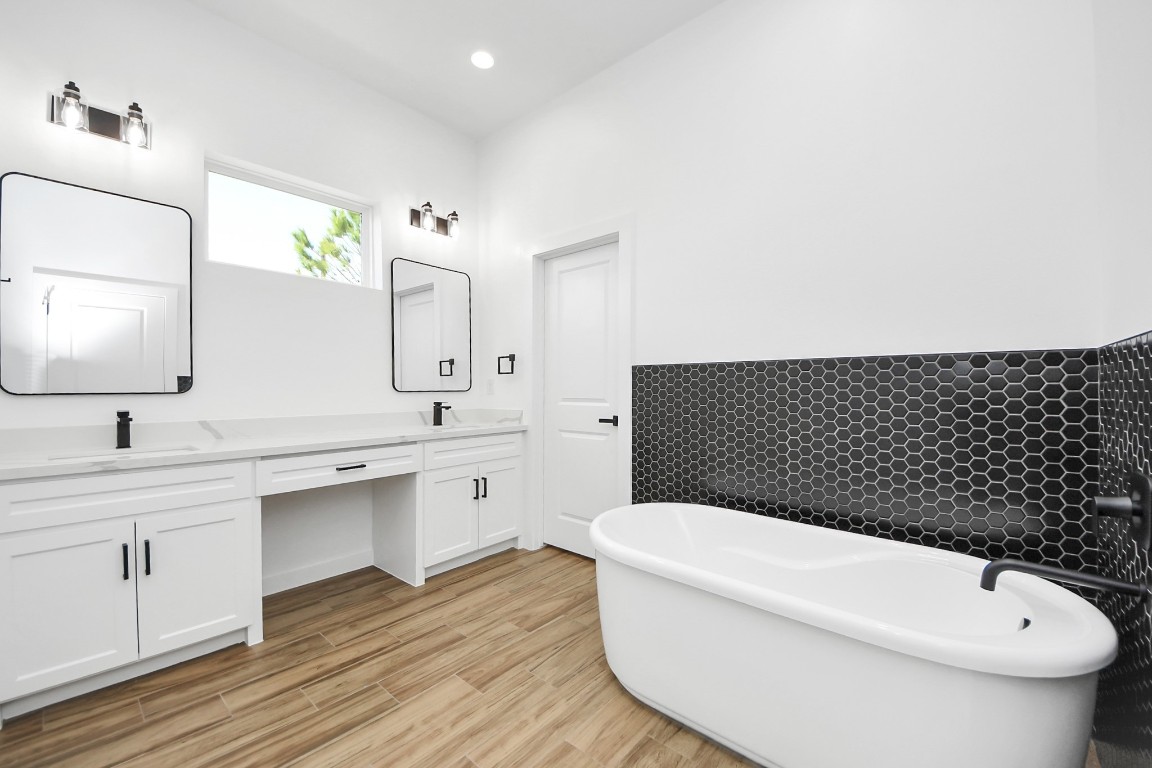 207 Manor Avenue Arcola, TX 77583 - Photo 32 of 37 a bathroom with a toilet sink and mirror