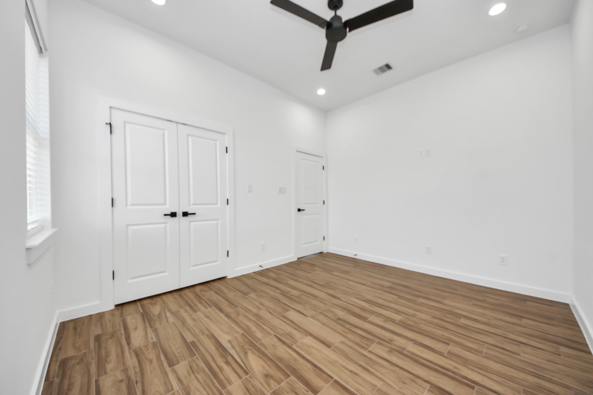 207 Manor Avenue Arcola, TX 77583 - Photo 6 of 37 a view of a room with wooden floor