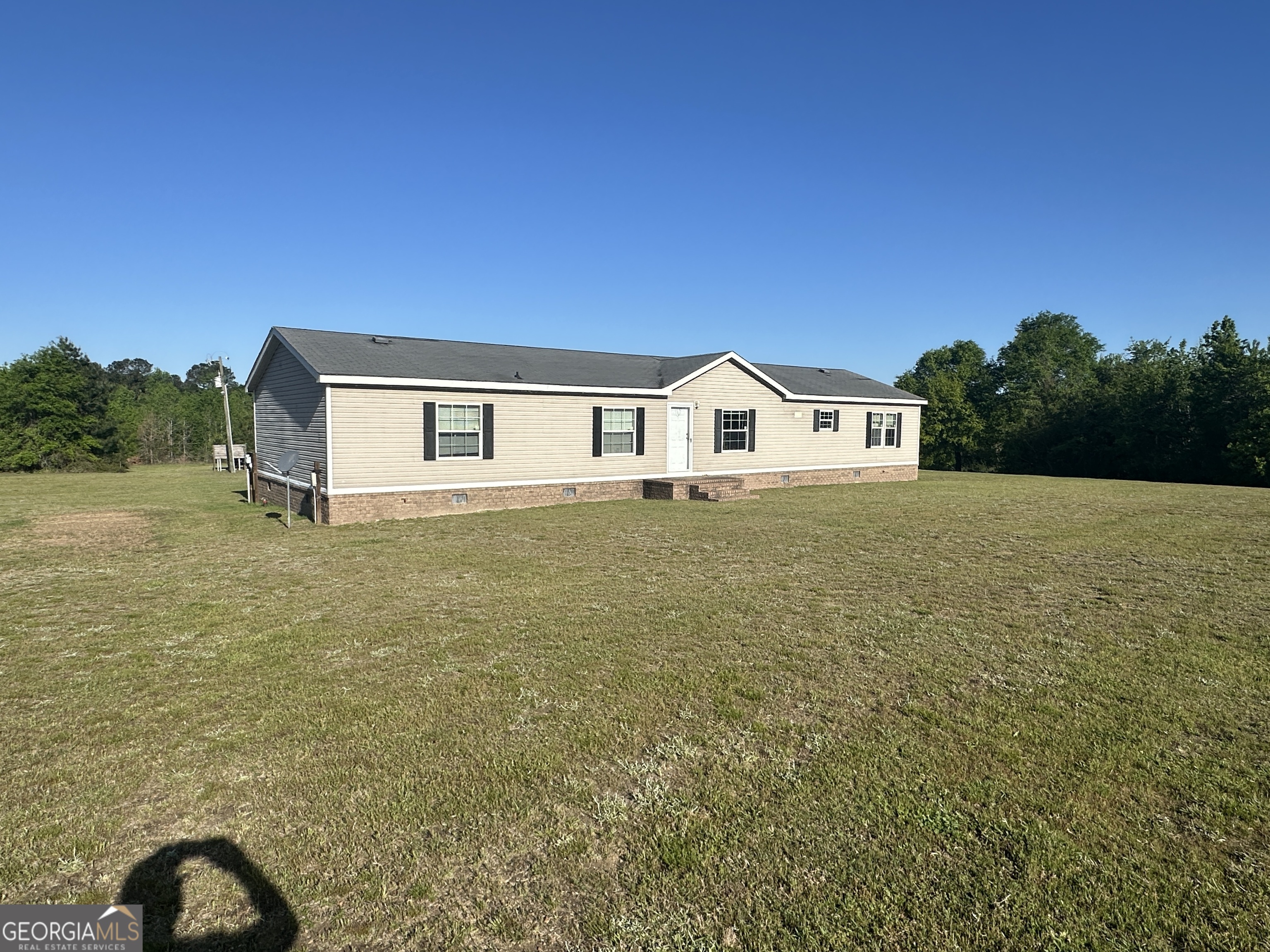 208 Oak Grove Lane Sylvania, GA 30467 - Photo 3 of 31 a view of a house with a yard