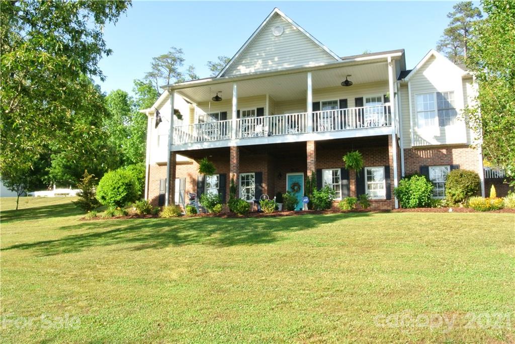 1911 Coxe Road Rutherfordton, NC 28139 - Photo 1 of 37 a front view of a building with a garden
