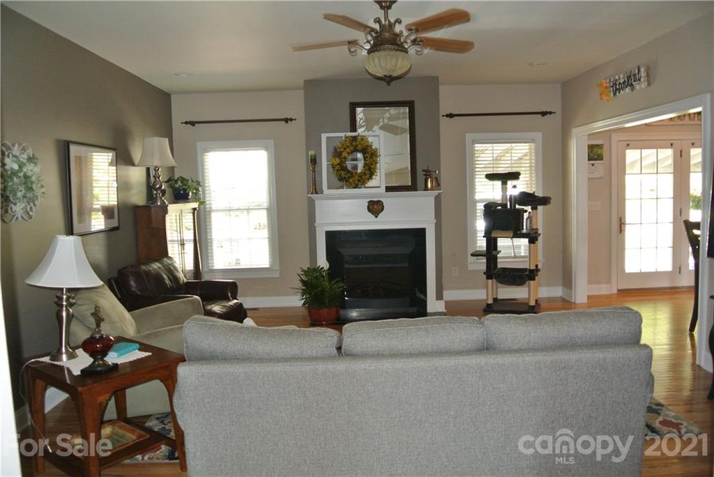 1911 Coxe Road Rutherfordton, NC 28139 - Photo 12 of 37 a living room with fireplace furniture and a flat screen tv