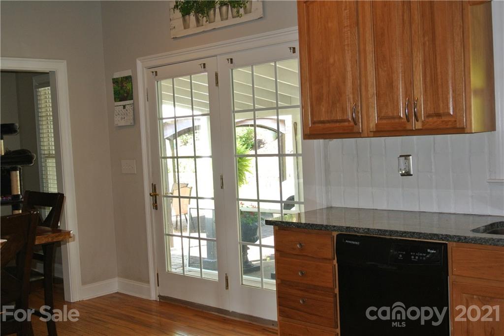 1911 Coxe Road Rutherfordton, NC 28139 - Photo 18 of 37 a kitchen with granite countertop wooden cabinets and a stove