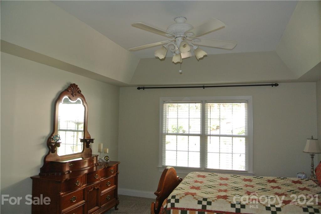 1911 Coxe Road Rutherfordton, NC 28139 - Photo 21 of 37 a bedroom with a bed and a window