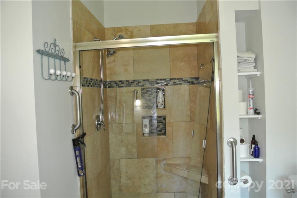 1911 Coxe Road Rutherfordton, NC 28139 - Photo 25 of 37 a bathroom with a glass shower door