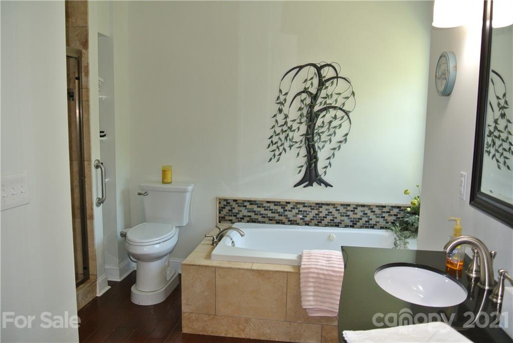 1911 Coxe Road Rutherfordton, NC 28139 - Photo 26 of 37 a bathroom with a granite countertop sink and a mirror