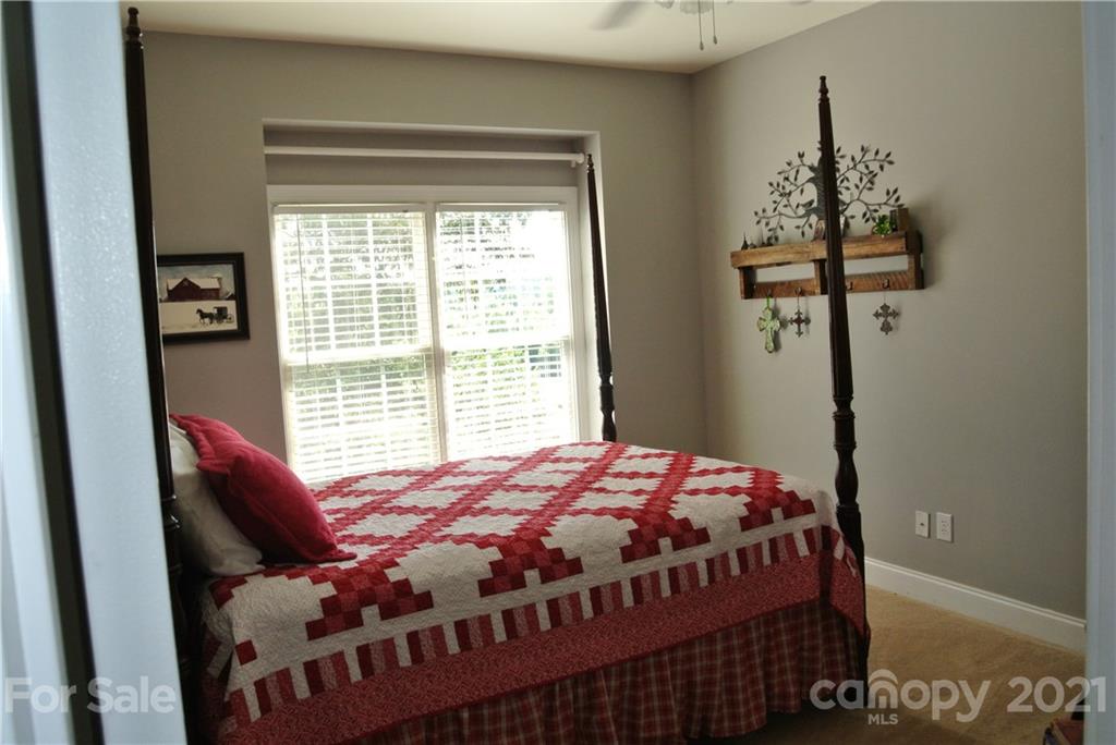 1911 Coxe Road Rutherfordton, NC 28139 - Photo 27 of 37 a bedroom with a bed and wooden floor