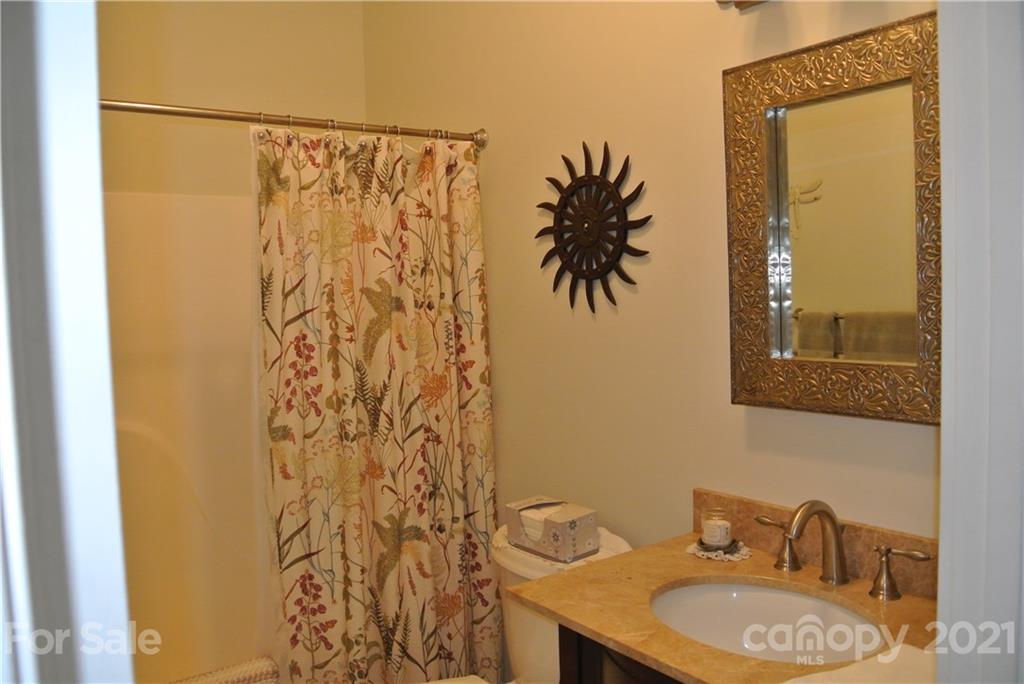 1911 Coxe Road Rutherfordton, NC 28139 - Photo 29 of 37 a bathroom with a granite countertop sink and a mirror