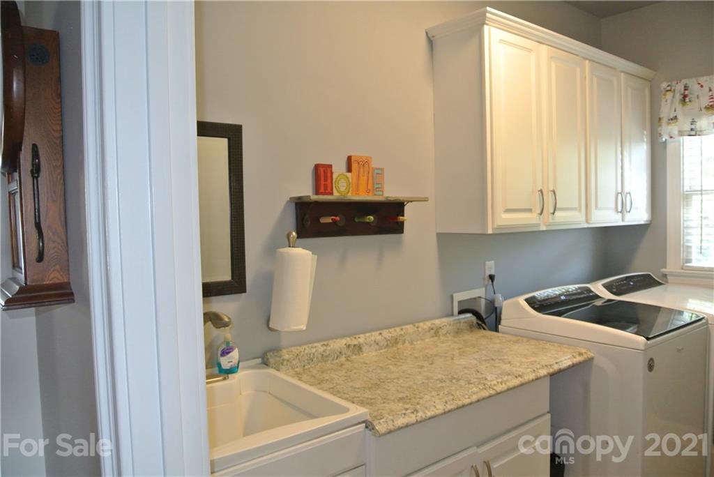 1911 Coxe Road Rutherfordton, NC 28139 - Photo 33 of 37 a kitchen with a sink cabinets and a window