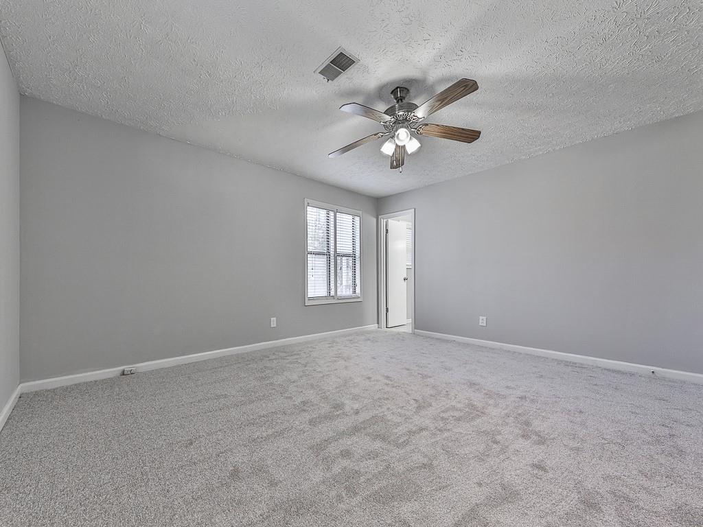 5506 Vaughn Road Woodstock, GA 30188 - Photo 20 of 33 a view of an empty room with a window