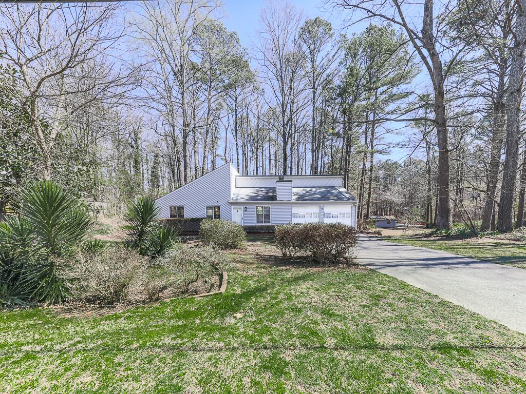 5506 Vaughn Road Woodstock, GA 30188 - Photo 22 of 33 a view of street with large trees