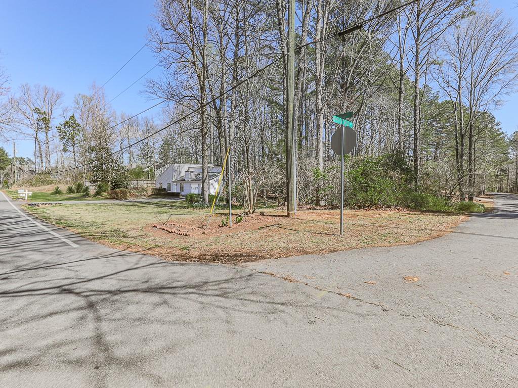 5506 Vaughn Road Woodstock, GA 30188 - Photo 23 of 33 a view of road with large trees