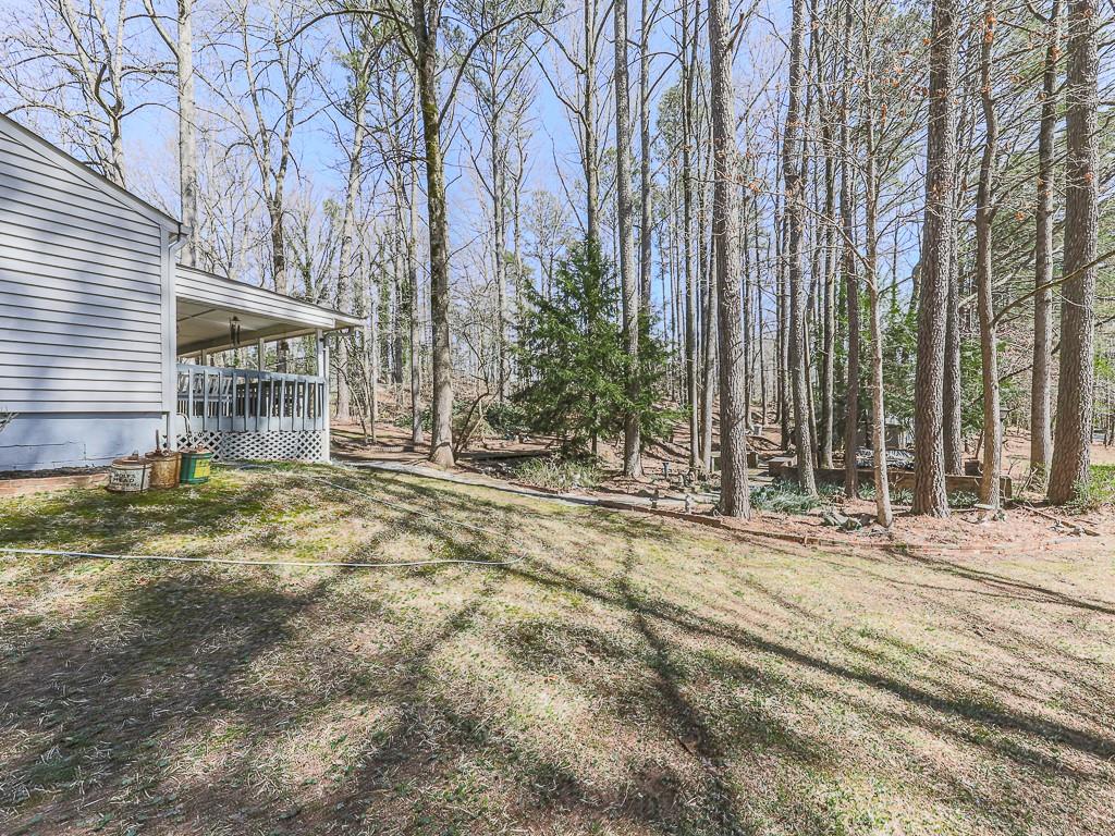 5506 Vaughn Road Woodstock, GA 30188 - Photo 24 of 33 a area with tree in front of it