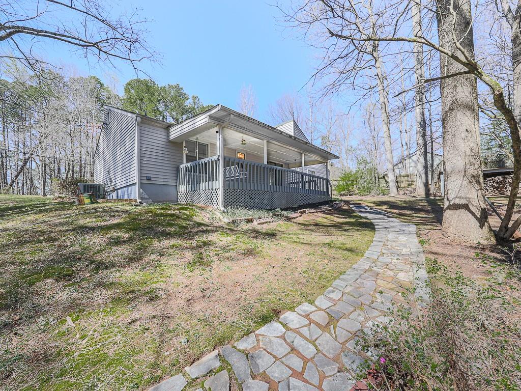 5506 Vaughn Road Woodstock, GA 30188 - Photo 25 of 33 a front view of a house with a yard
