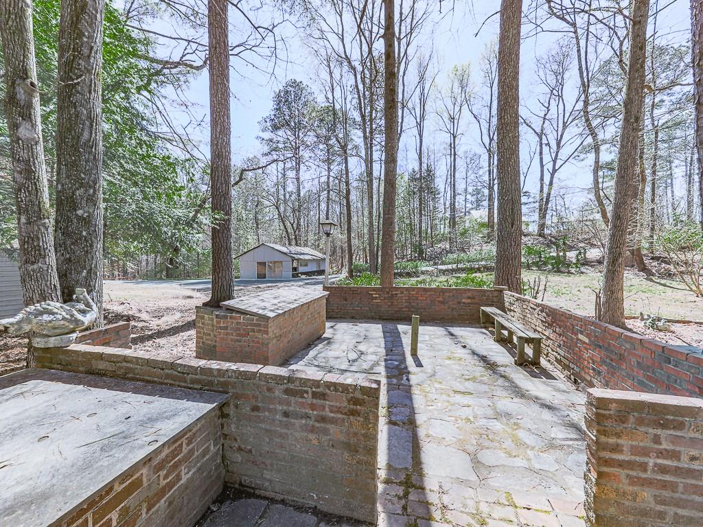 5506 Vaughn Road Woodstock, GA 30188 - Photo 28 of 33 a view of a yard with an outdoor space