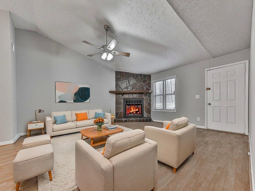 5506 Vaughn Road Woodstock, GA 30188 - Photo 3 of 33 a living room with furniture and a fireplace