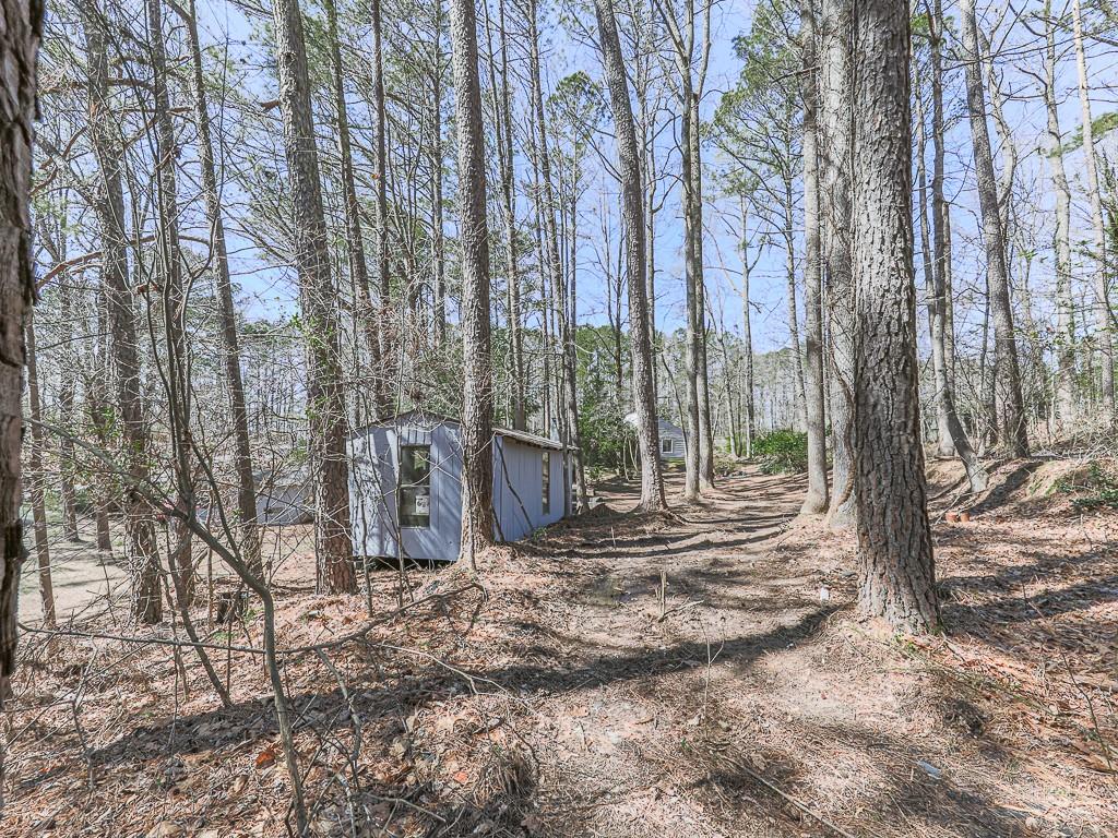 5506 Vaughn Road Woodstock, GA 30188 - Photo 31 of 33 a view of a backyard with trees