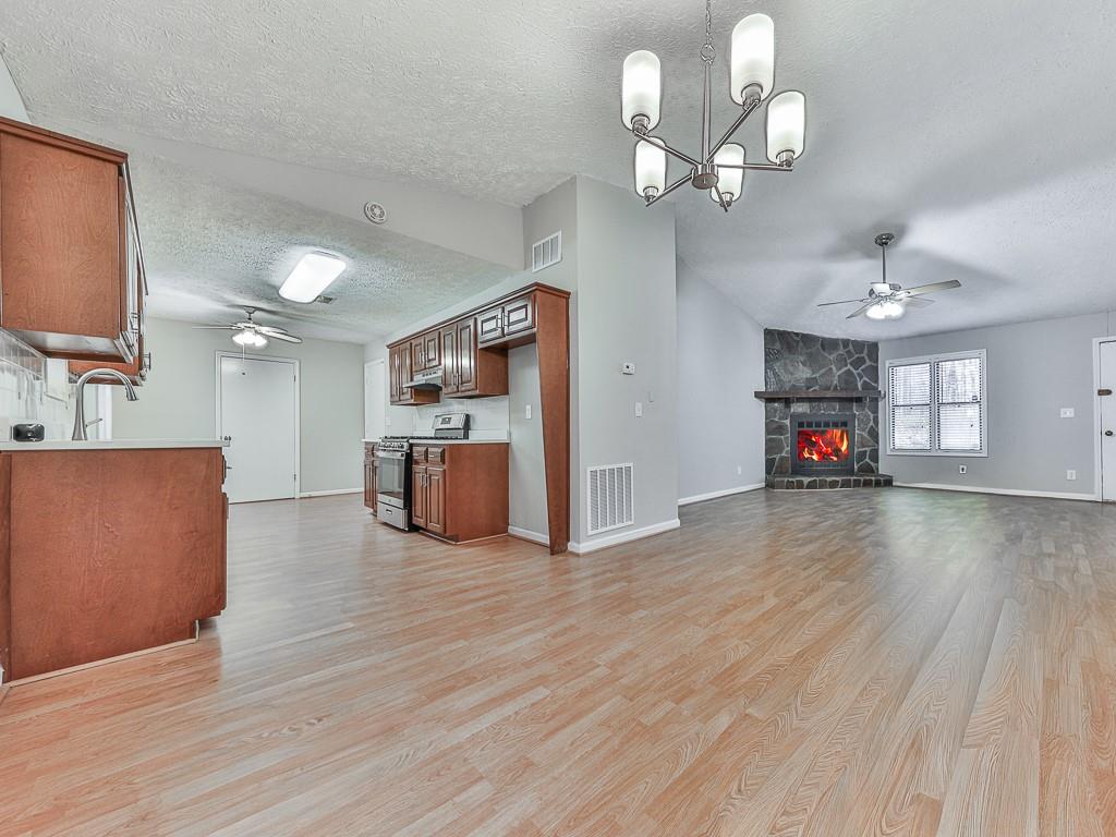5506 Vaughn Road Woodstock, GA 30188 - Photo 8 of 33 a living room with furniture and a wooden floor