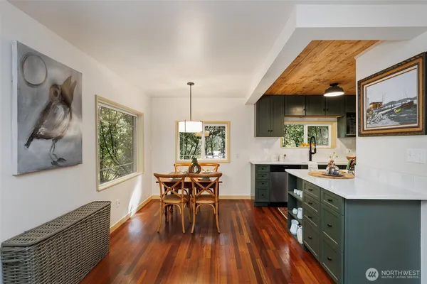 a view of a dining room with furniture window and wooden floor