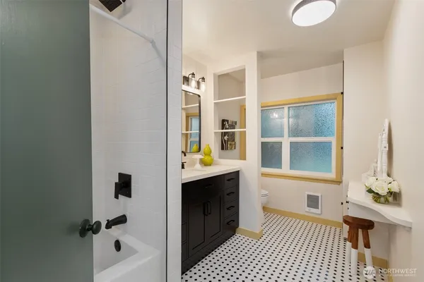 a bathroom with a bathtub and a shower
