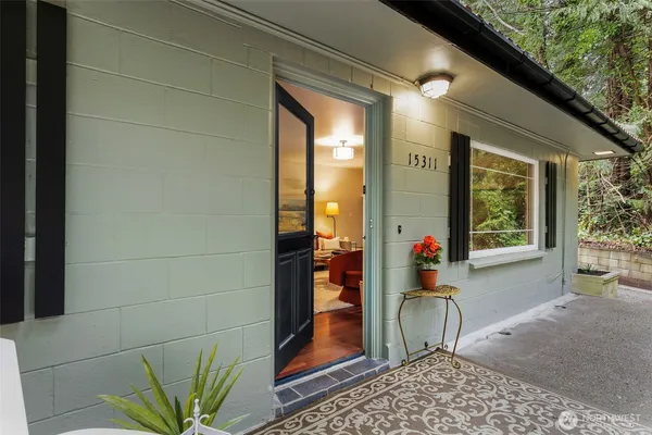a front view of a house with outdoor seating