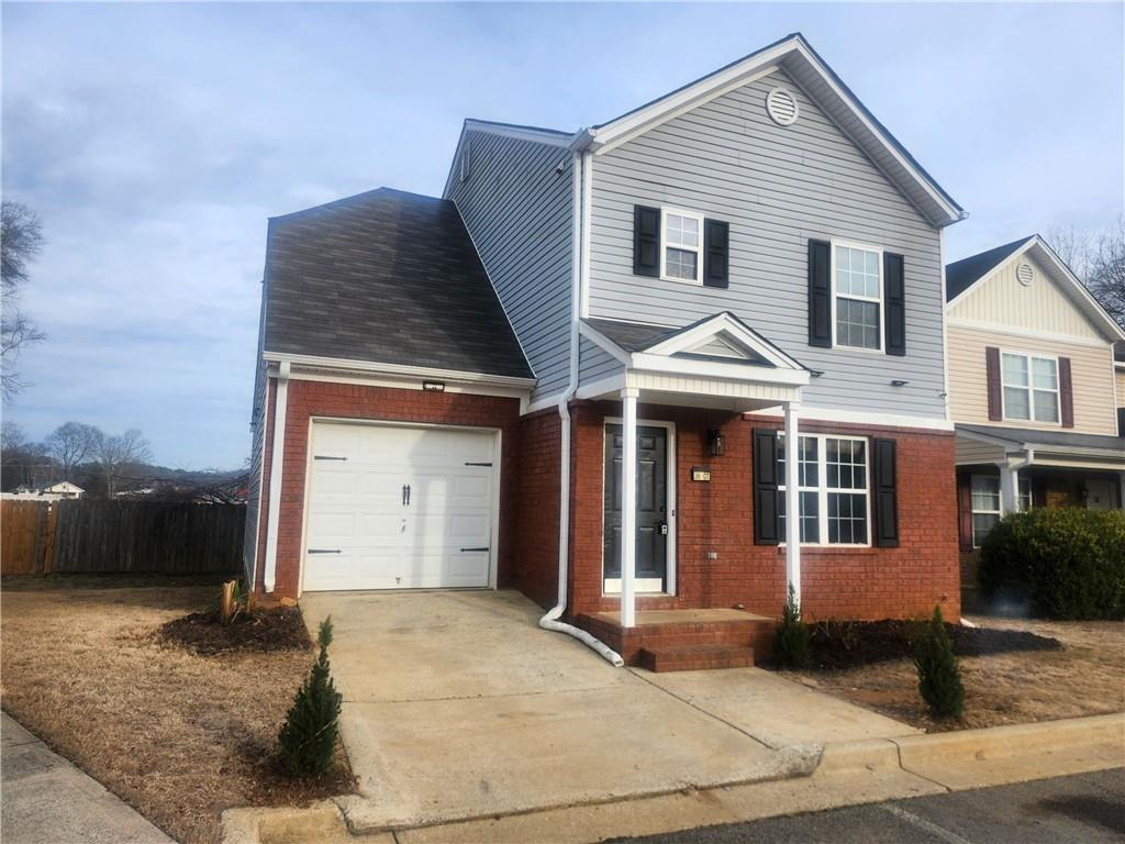38 Middleton Court Cartersville, GA 30120 - Photo 2 of 47 a front view of a house with a yard and garage