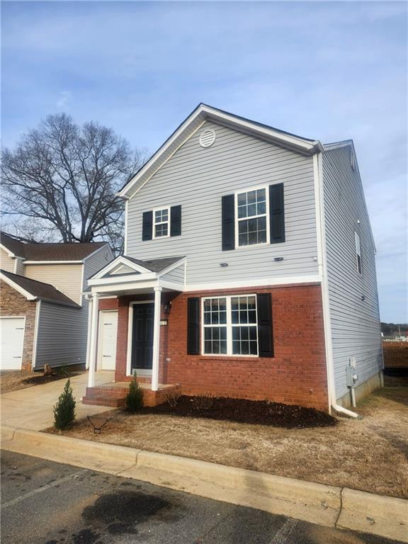 38 Middleton Court Cartersville, GA 30120 - Photo 3 of 47 a front view of a house with a yard