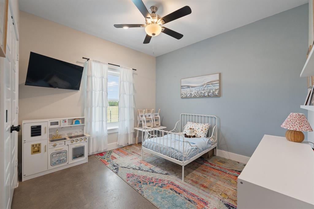 1031 Augustus Court Rio Vista, TX 76093 - Photo 15 of 30 Interior room featuring high ceilings, a ceiling fan with integrated lighting, and a window with natural light