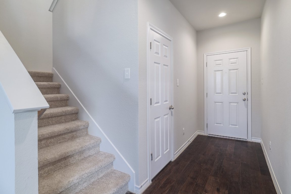 6792 Catania Loop Round Rock, TX 78665 - Photo 13 of 31 a view of a hallway with wooden floor and entryway
