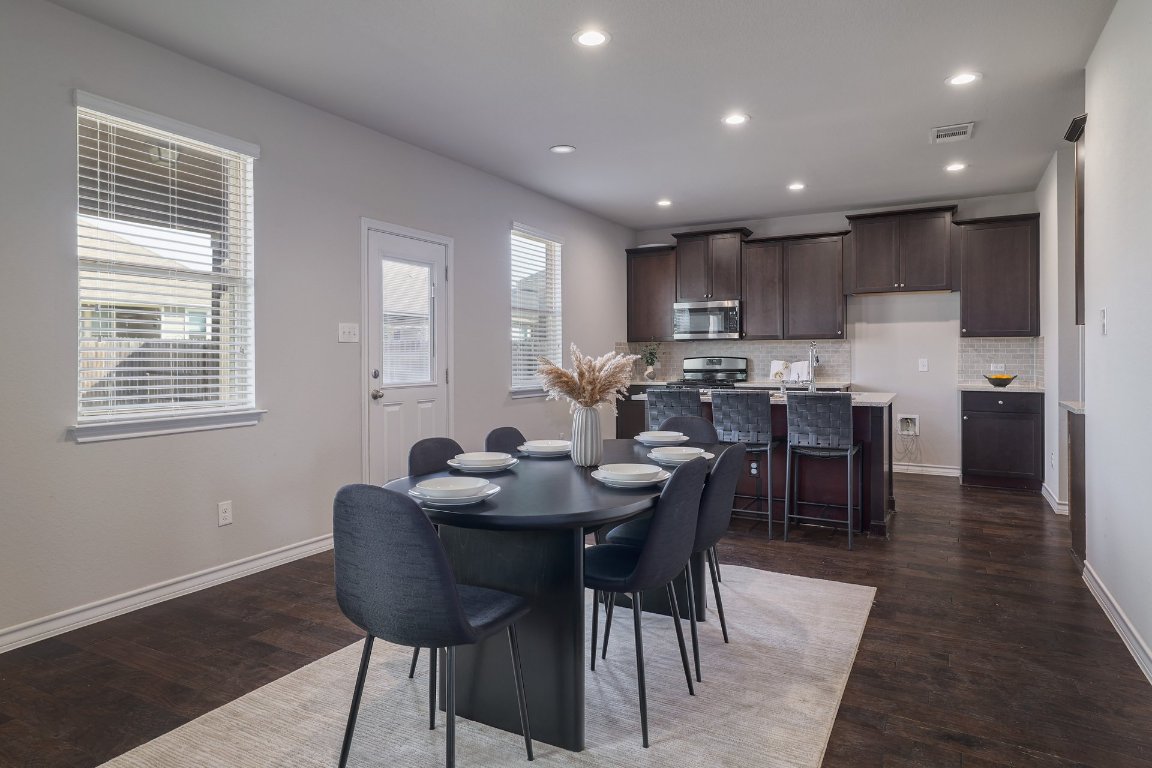 6792 Catania Loop Round Rock, TX 78665 - Photo 6 of 31 a view of a dining room with furniture