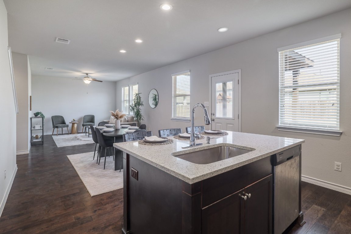 6792 Catania Loop Round Rock, TX 78665 - Photo 9 of 31 a kitchen with sink and view of living room