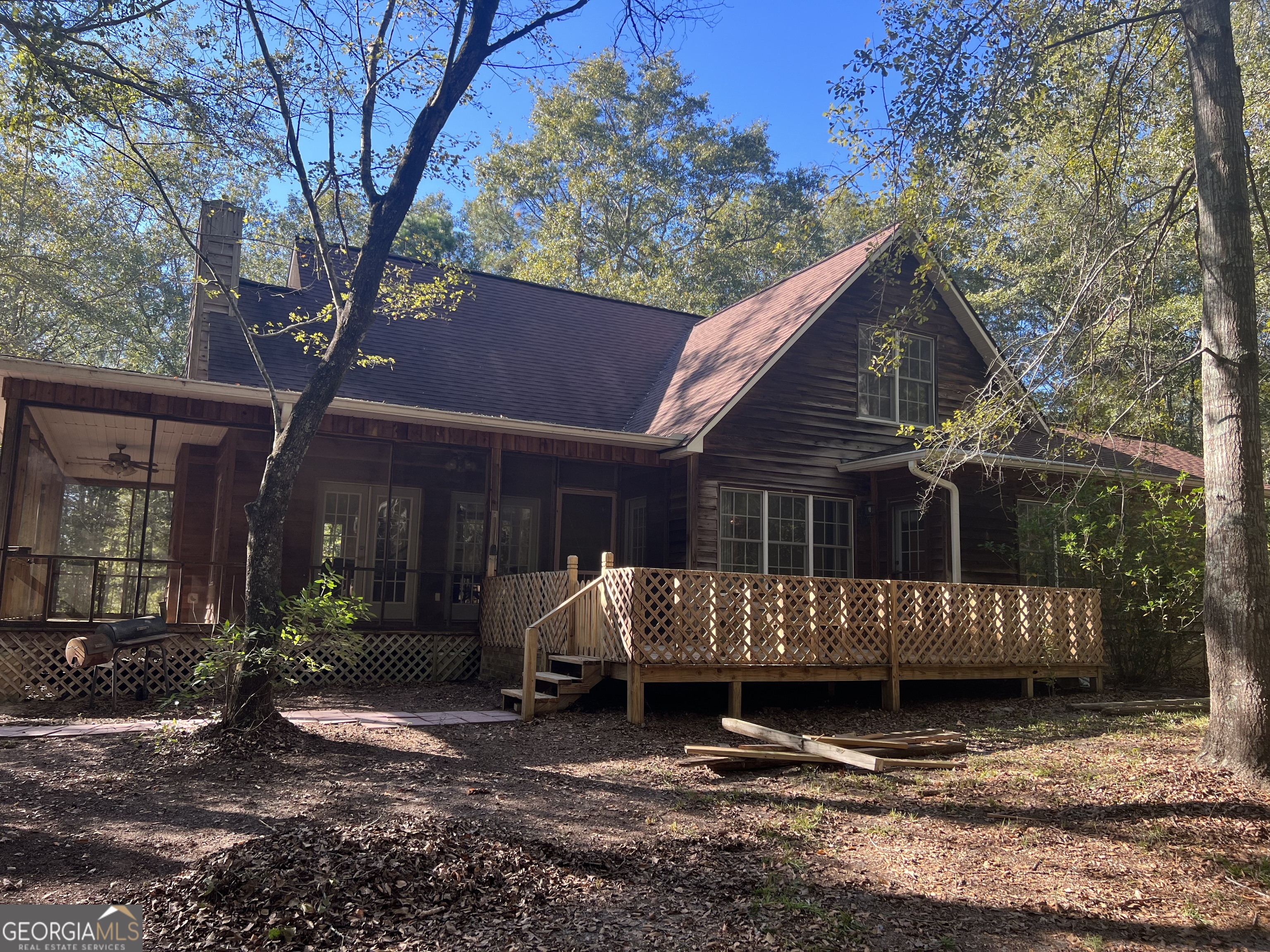 274 Gillis Road Adrian, GA 31002 - Photo 1 of 1 a view of a house with a yard in a forest