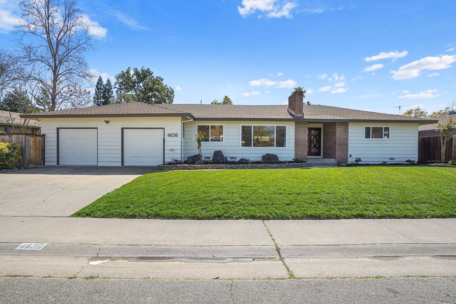 4636 Gibbons Drive Sacramento, CA 95821 - Photo 1 of 1 a front view of house with a garden and yard
