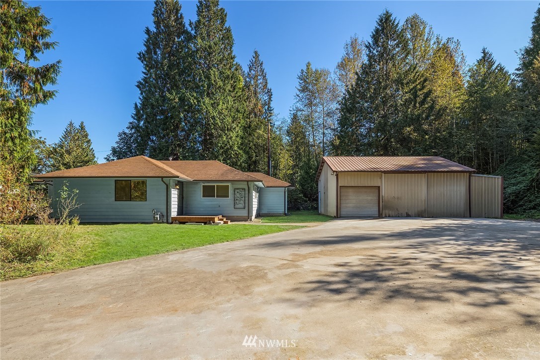 19115 Southeast 128th Street Renton, WA 98059 - Photo 2 of 21 a yellow house with trees in the background