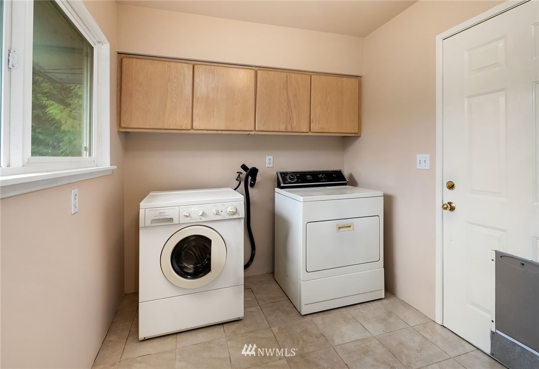 19115 Southeast 128th Street Renton, WA 98059 - Photo 14 of 21 a utility room with sink dryer and washer