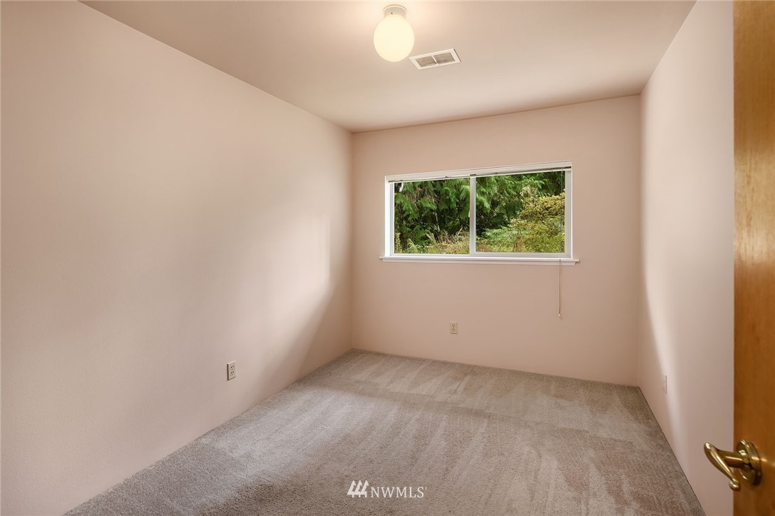 19115 Southeast 128th Street Renton, WA 98059 - Photo 17 of 21 an empty room with a window