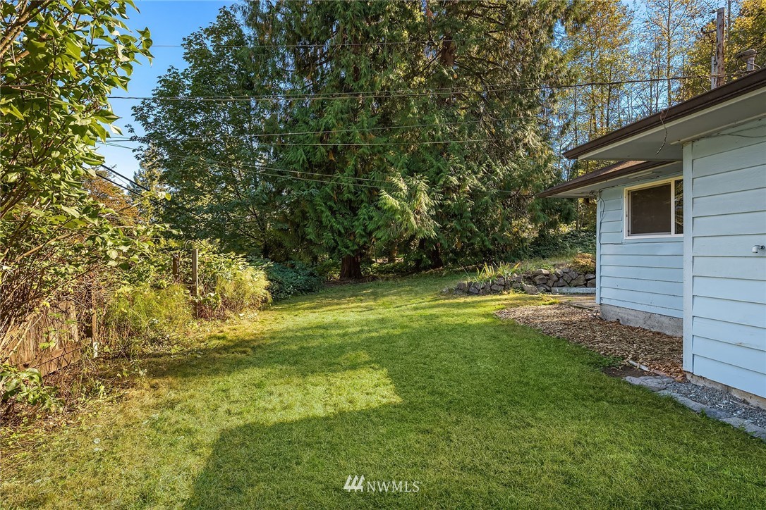 19115 Southeast 128th Street Renton, WA 98059 - Photo 3 of 21 a view of swimming pool with a yard