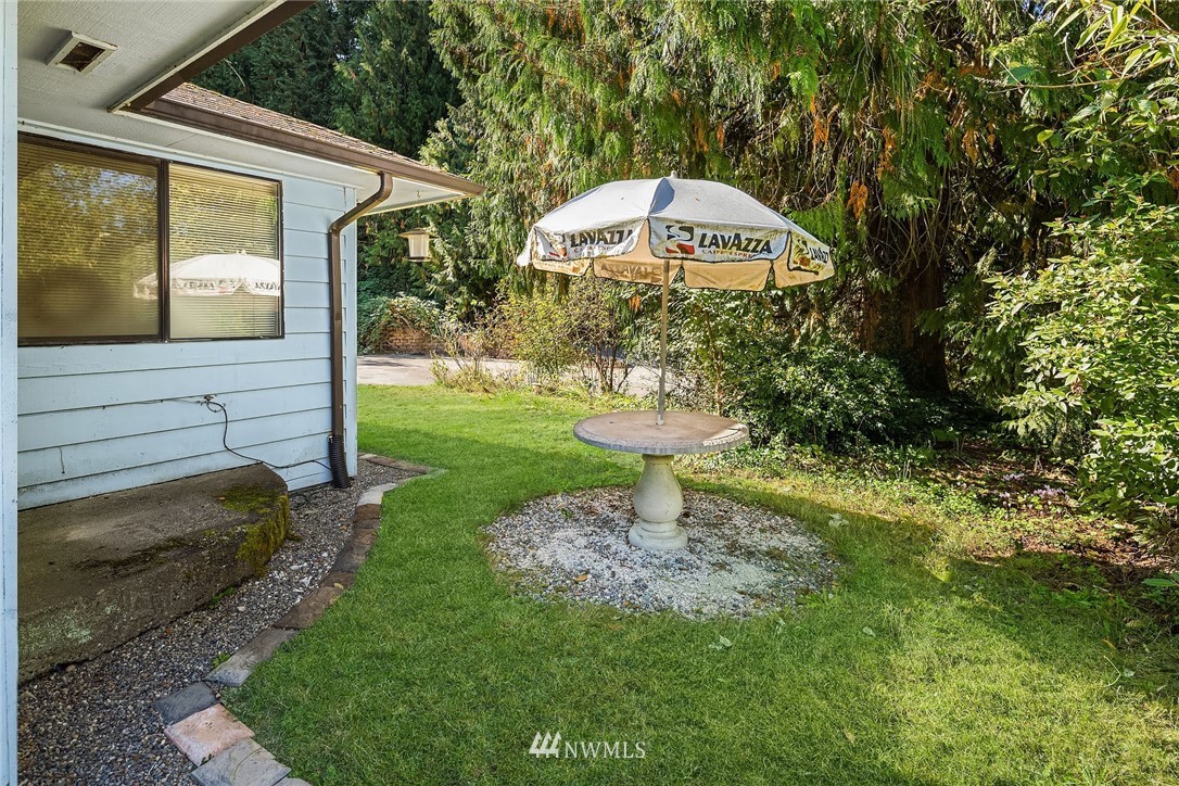 19115 Southeast 128th Street Renton, WA 98059 - Photo 5 of 21 a view of a bench in front of house