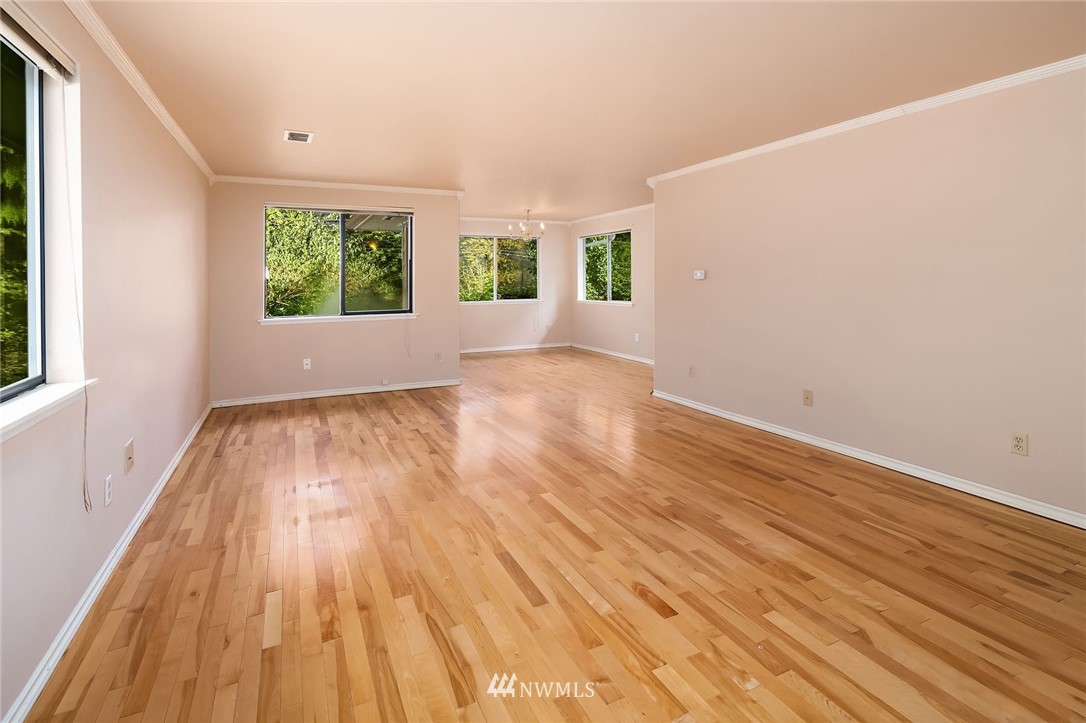 19115 Southeast 128th Street Renton, WA 98059 - Photo 7 of 21 wooden floor in an empty room with a window