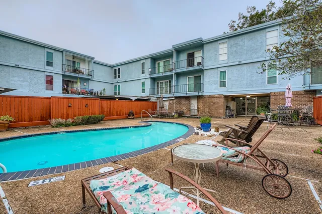 an outdoor space with lounge chair