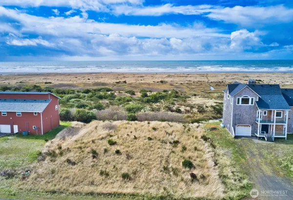 a view of a stone house with a yard