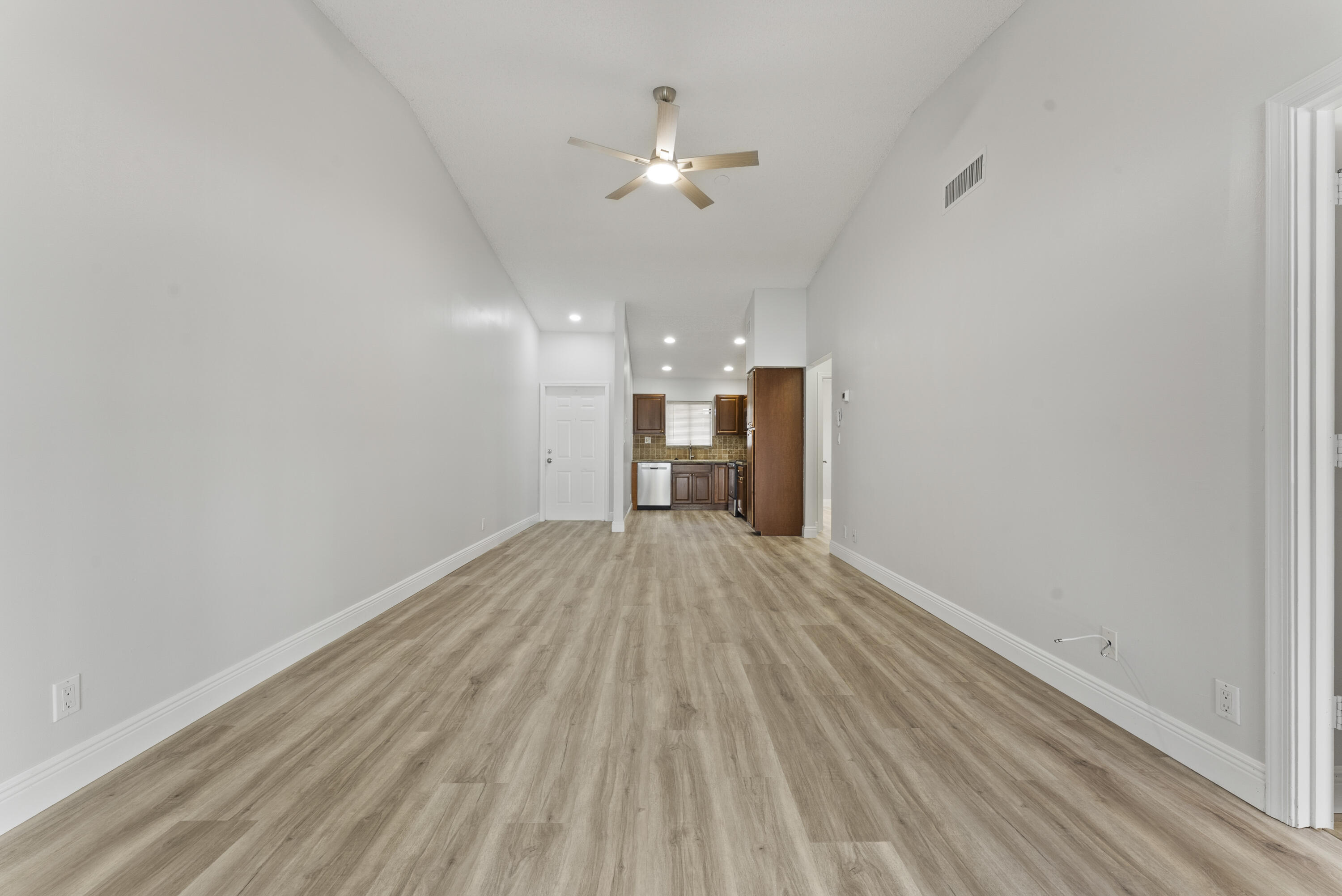 2900 Olivewood Terrace, Unit 2010 Boca Raton, FL 33431 - Photo 9 of 22 wooden floor in an empty room with a window
