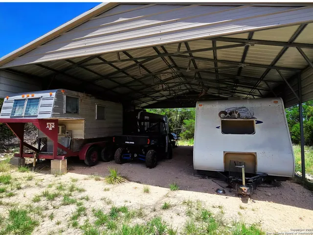 a view of a chairs and table in patio